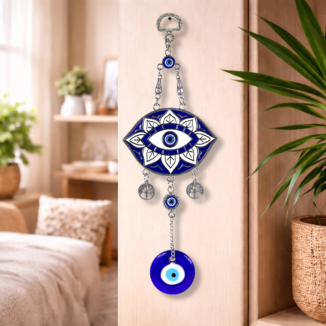 Decorative wall hanging with eye design in a home setting