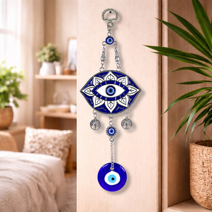 Decorative wall hanging with eye design in a home setting