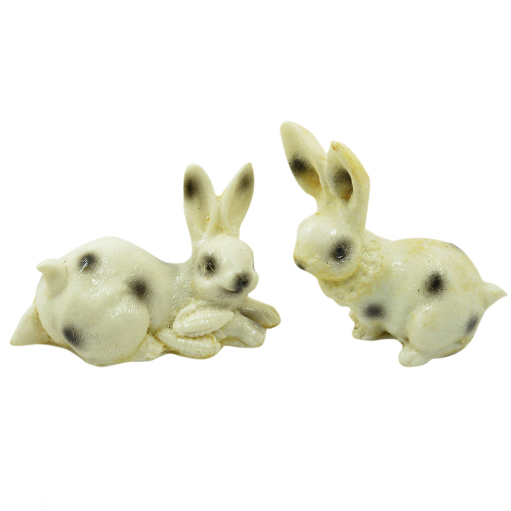 White and Black Rabbit Figurines