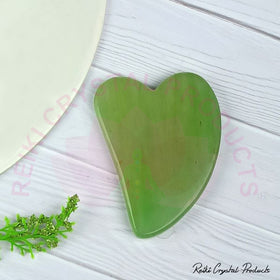 green jade gua sha facial tool