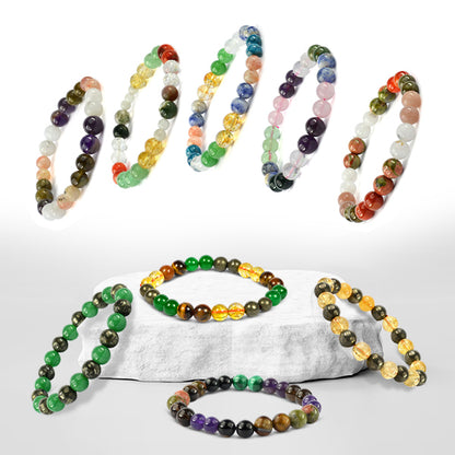 Set of colorful beaded bracelets on a white background