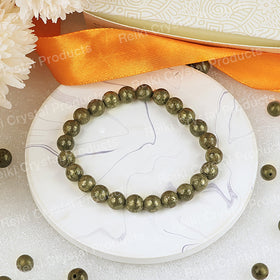 Pyrite gemstone bracelet with round beads for confidence and success