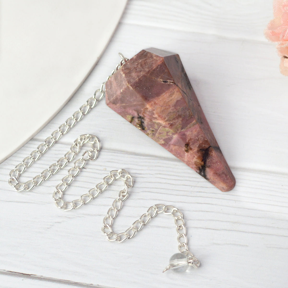rhodonite Six faceted dowser pendulum charged by Reiki Grandmaster
